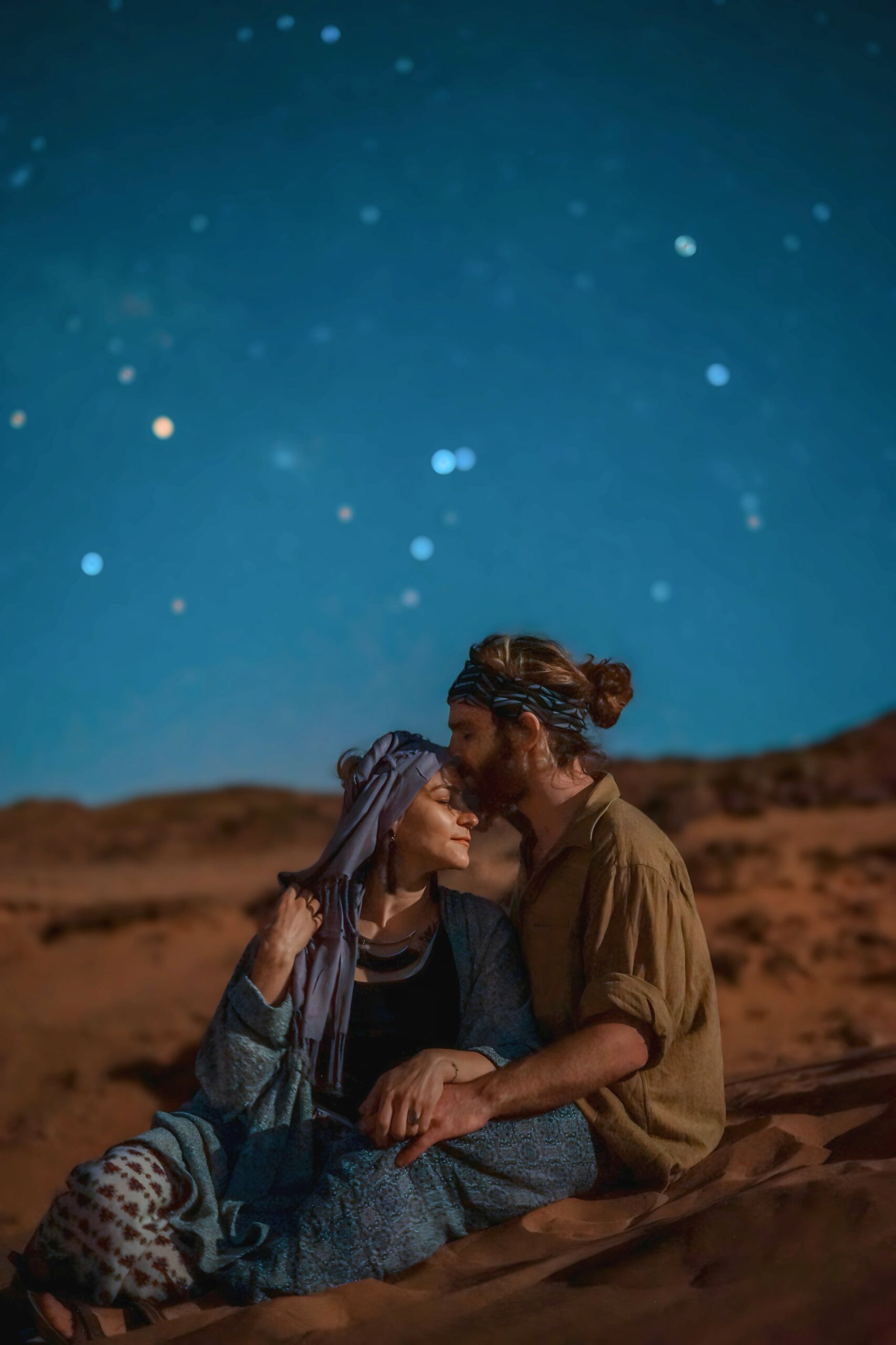 CoupleinDesertunderStars Couple embrace in desert under stars - Deep Morocco Tours Couples Luxury Tour